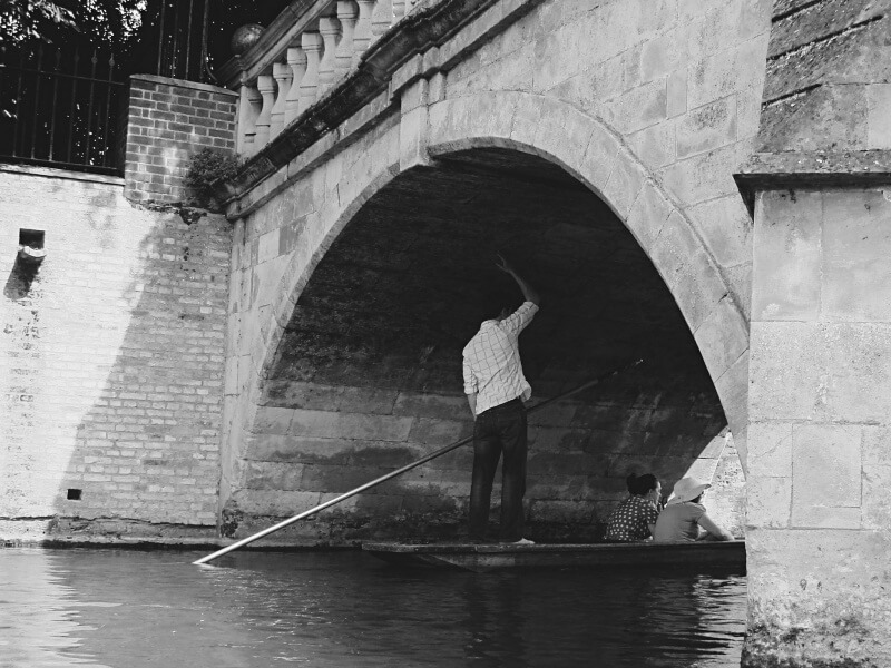 A punter goes under the bridge in Cambridge