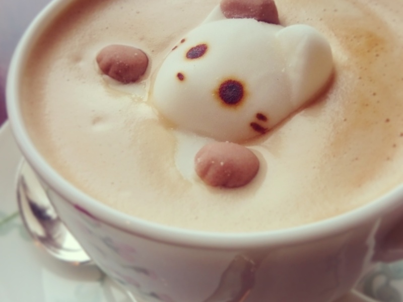 Foam art on coffee at a quirky cafe in Tokyo